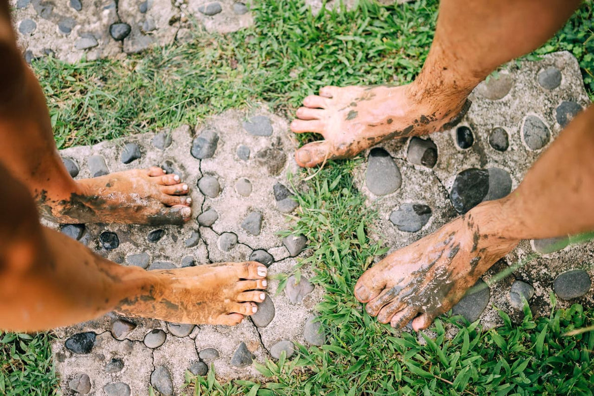 Earthing Harmony team members connecting barefoot with the ground